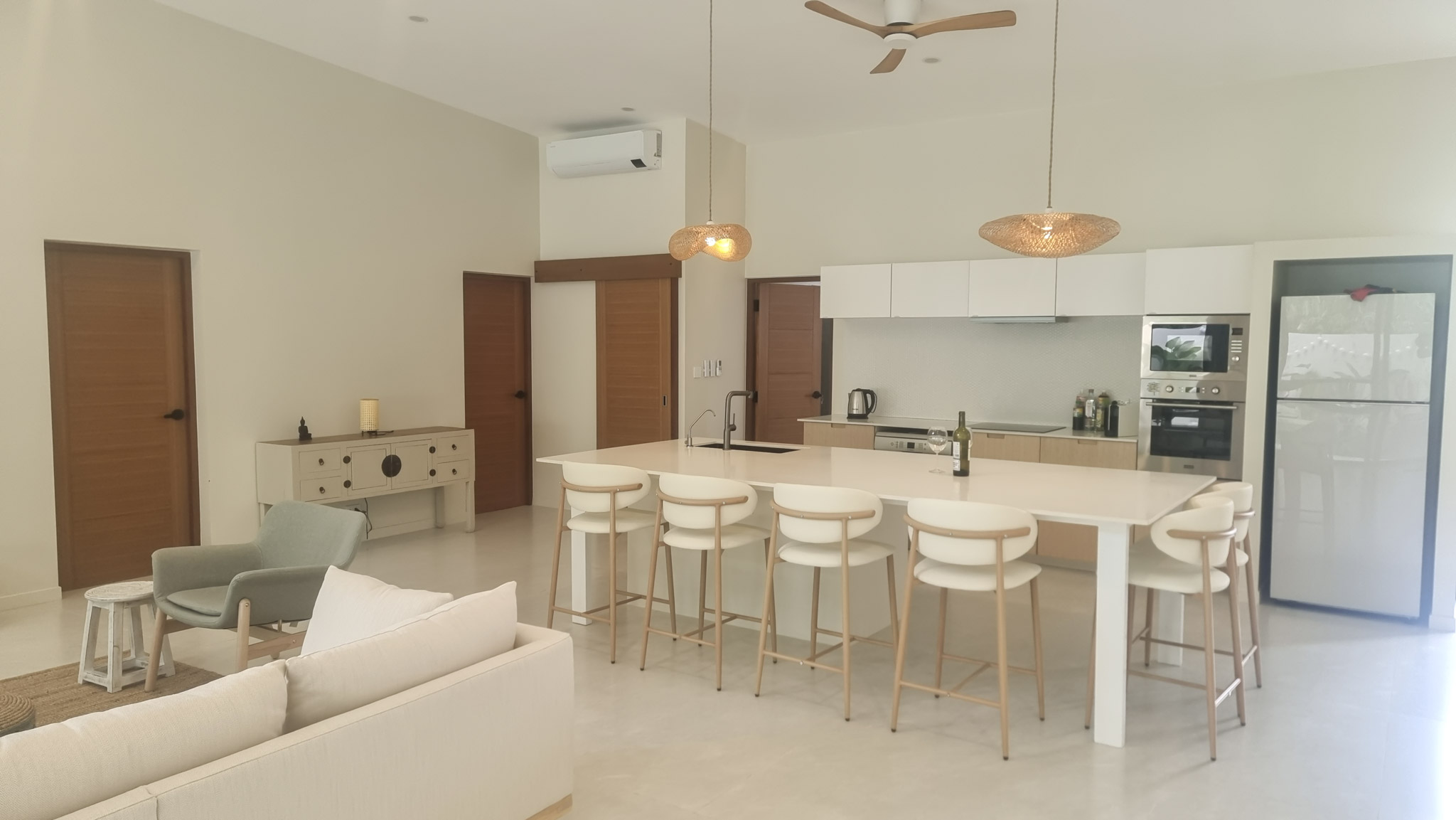 Fully equipped open-plan kitchen and dining area at Pool Villa Lamai with island counter and modern appliances